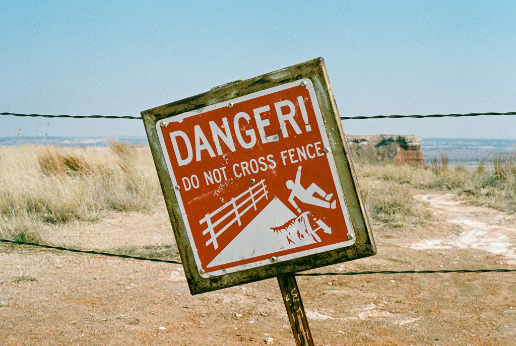 Warning sign at the end of the trail